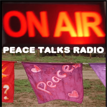 A radio station promoting peace talks with colorful peace flags.