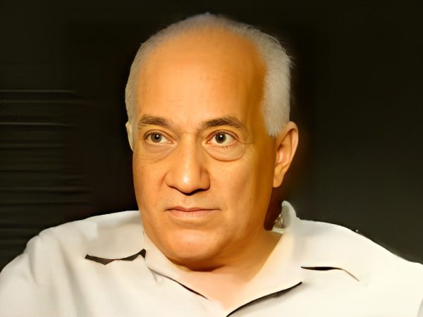 Portrait of an elderly man with white hair and a calm expression.